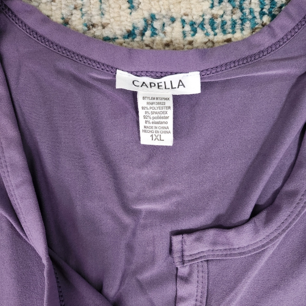 Purple onsie. Never worn. Very soft fabric